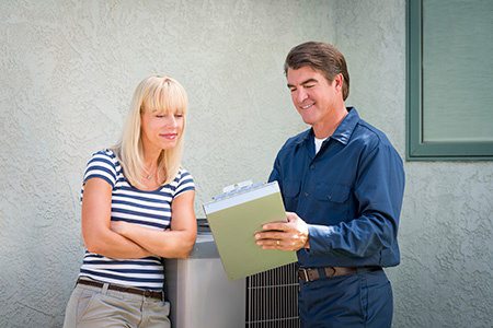 hvac worker consulting with customer