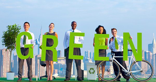 People Holding Letters Spelling GREEN